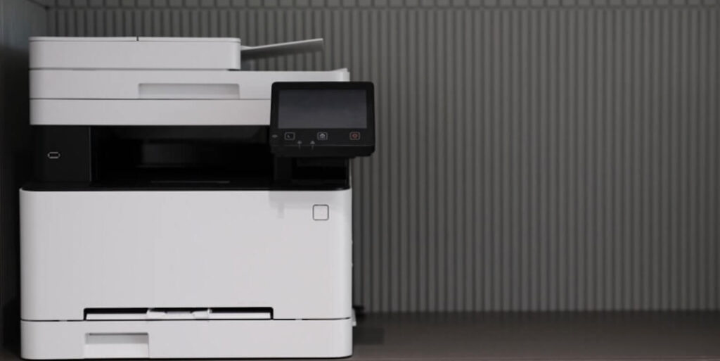 a white and black printer sitting on top of a counter FEATURED IMAGE