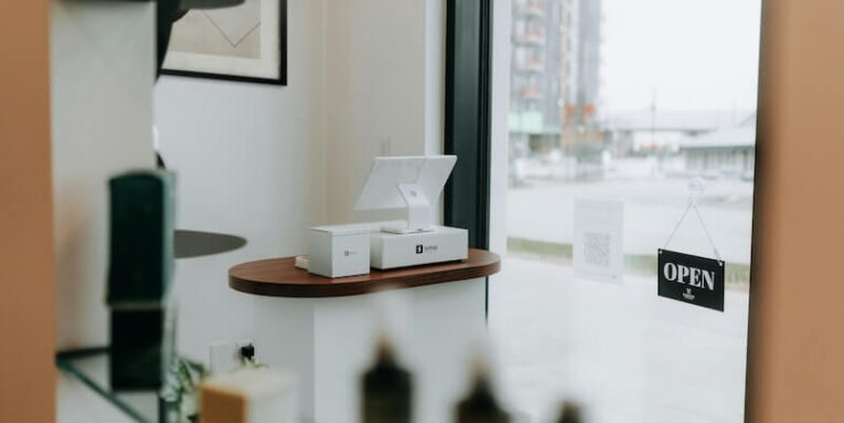 a modern retail display with window and open sign FEATURED IMAGE