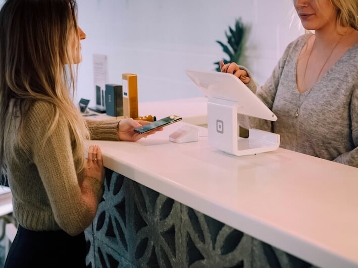 woman standing near monitor