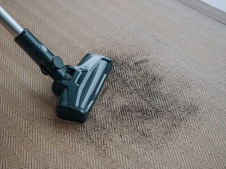 a close up of a vacuum on a carpet