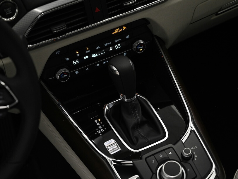 a close up of a cars dashboard with a steering wheel