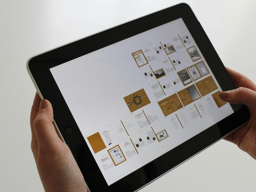 Person Holding Black Ipad