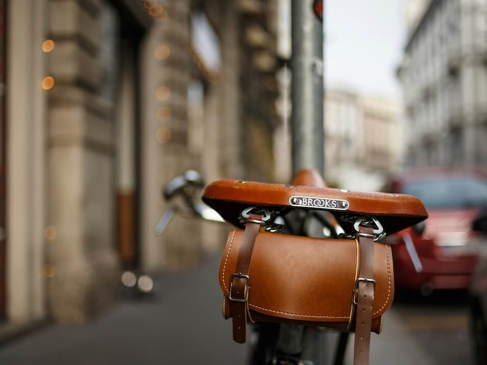 brown and black bicycle on road during daytime