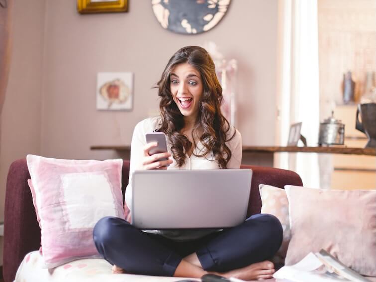 Woman Sitting While Using Cellphone