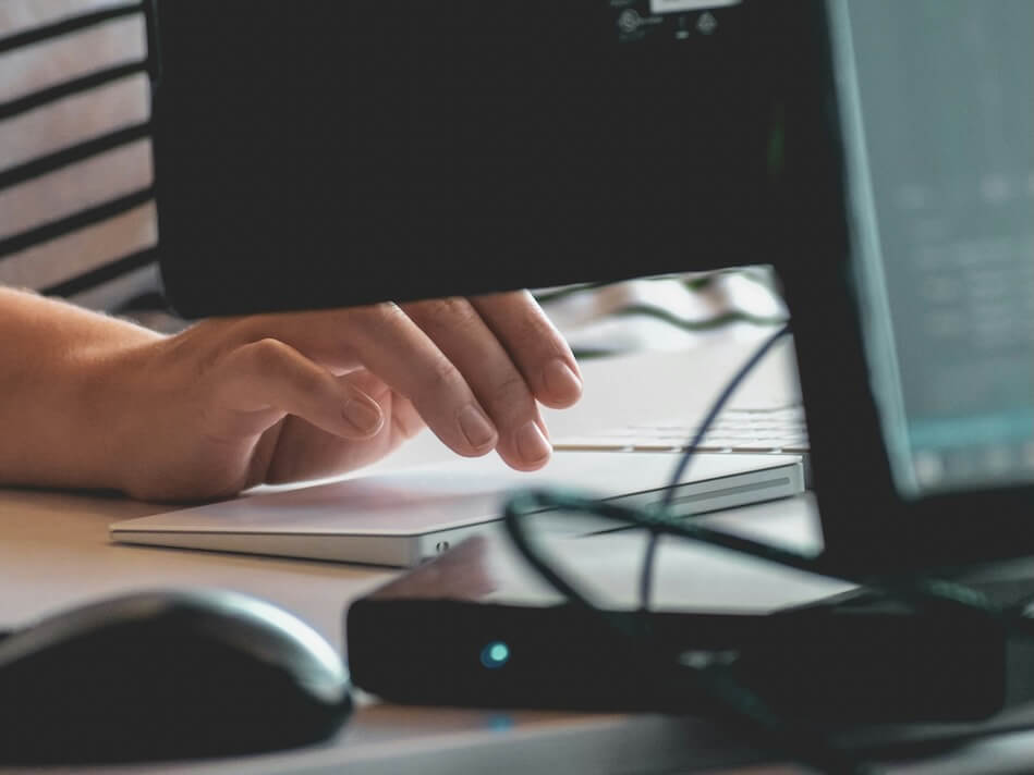 person using computer on table