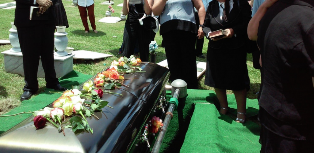 group of people attending burial