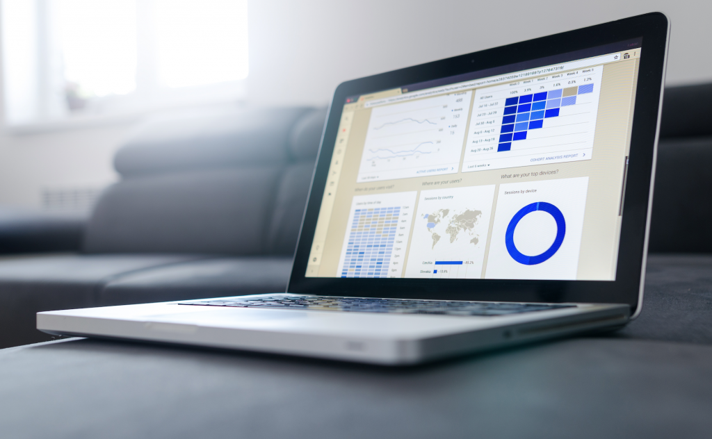 Notebook work with statistics on sofa business