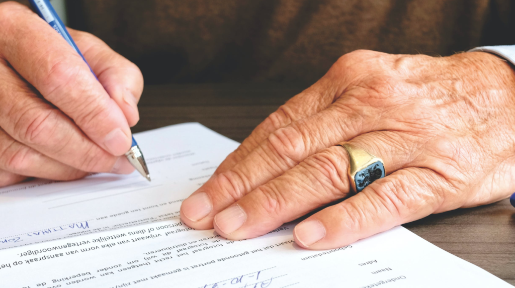 Person Signing Document Paper
