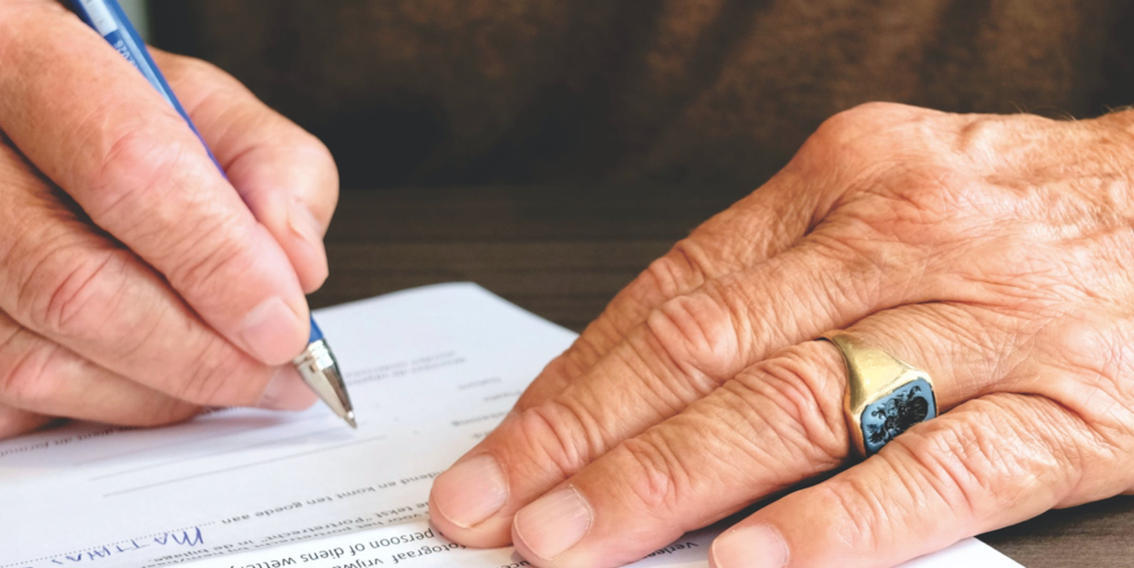 Person Signing Document Paper FEATURED IMAGE