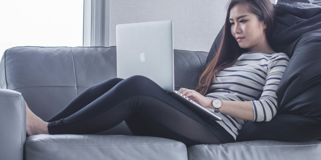 woman sitting on sofa while using MacBook pro FEATURED IMAGE