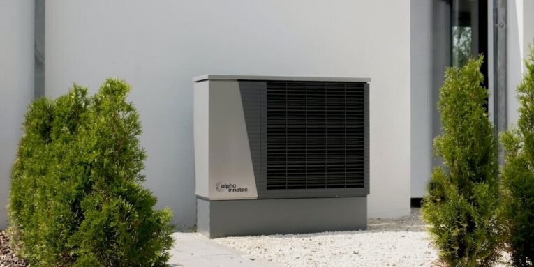 heating and air-conditioner sitting on the side of house FEATURED IMAGE