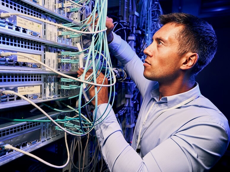 man handling fiber optic cables