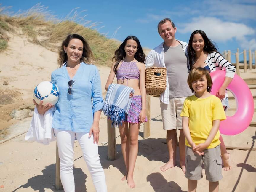 Family Posing Together While on the Beach