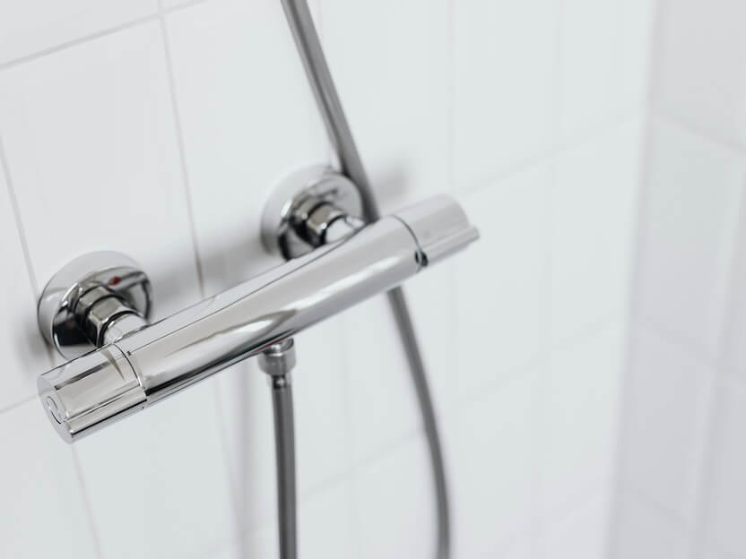 Stainless Steel Pipe on Ceramic Wall
