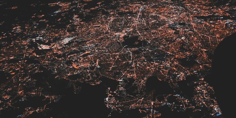 lighted city at night aerial