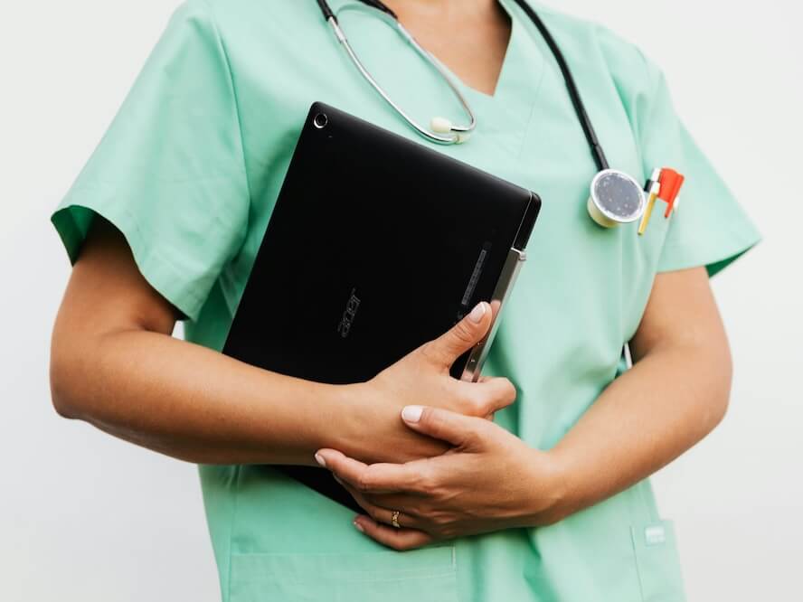 A Doctor Holding a Digital Tablet