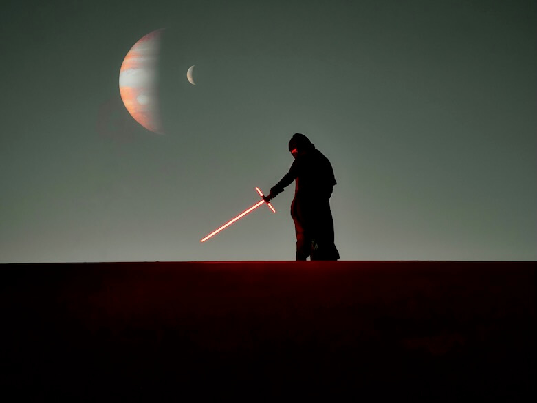 a man that is standing in the dark