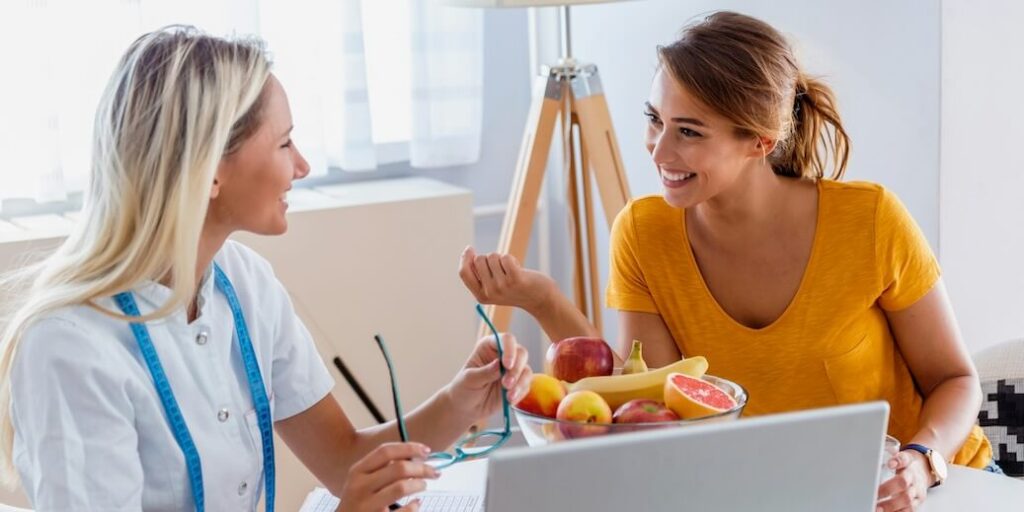 doctor nutritionist dietician and female patient on consultation in the office female nutritionist giving consultation to patient making diet plan | FEATURED IMAGE