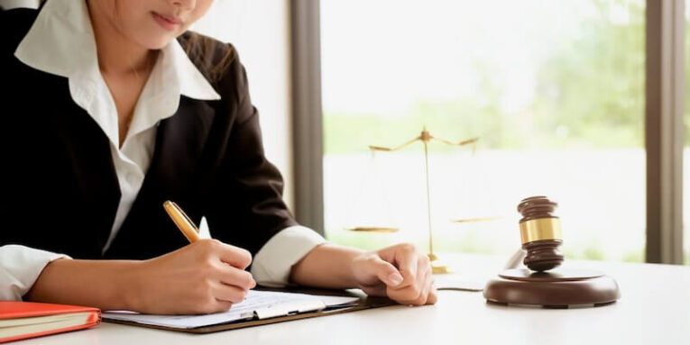 lawyer woman working in workplace with window light at morning time FEATURE IMAGE