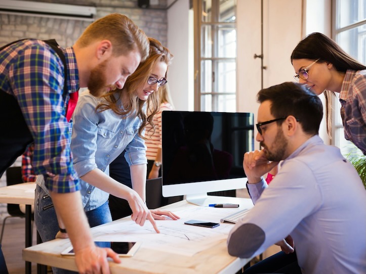 business coworkers and architects working on project together in office