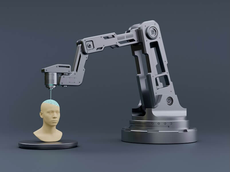 a robot arm is holding a human head