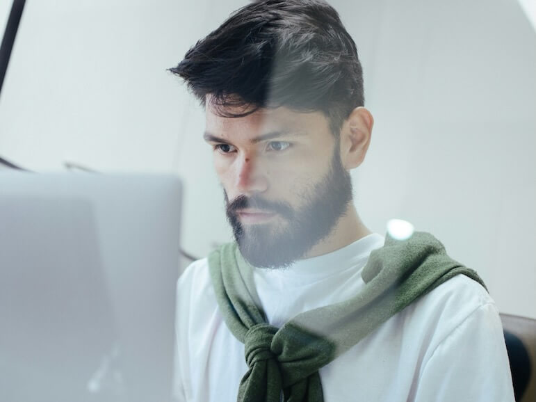 man facing MacBook pro