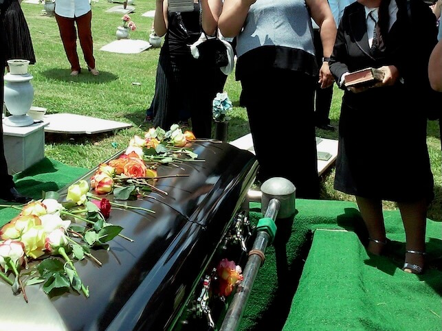 group of people attending burial