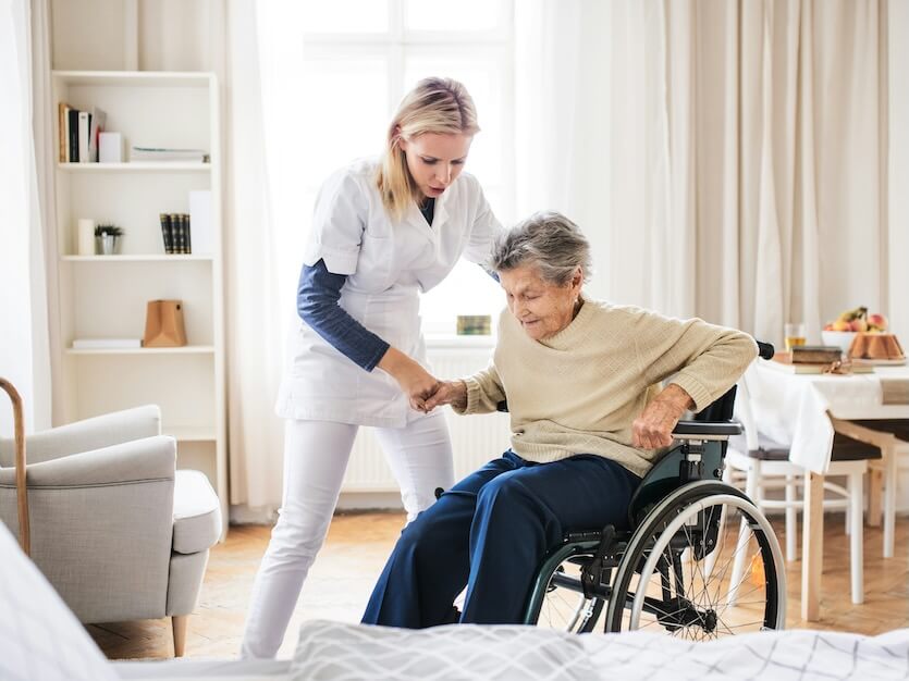 https://unsplash.com/photos/a-young-health-visitor-helping-a-senior-woman-to-stand-up-from-a-wheelchair-at-home-YY0x6jgERv8