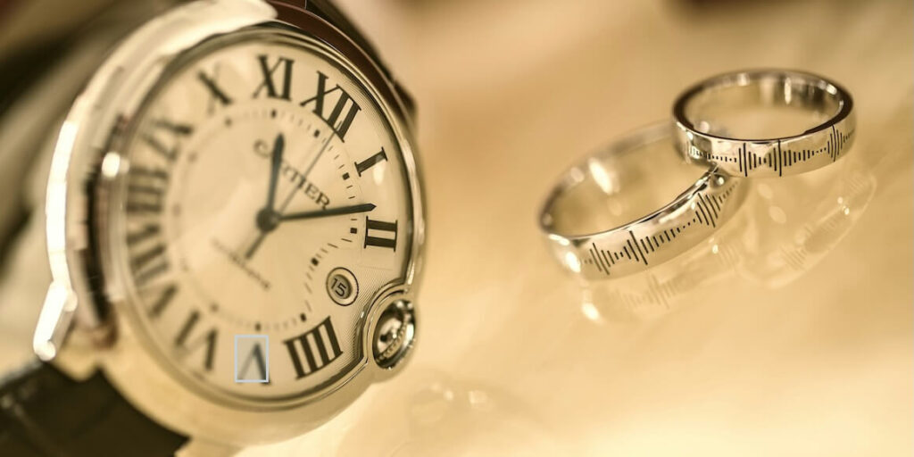 silver colored analog watch near two silver colored rings FEATURED IMAGE