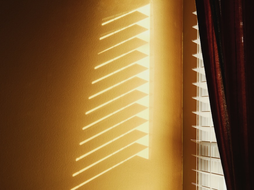 the shadow of a window on a wall