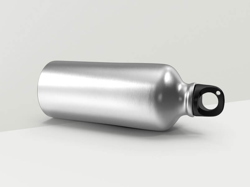 a silver bottle with a black cap on a white surface