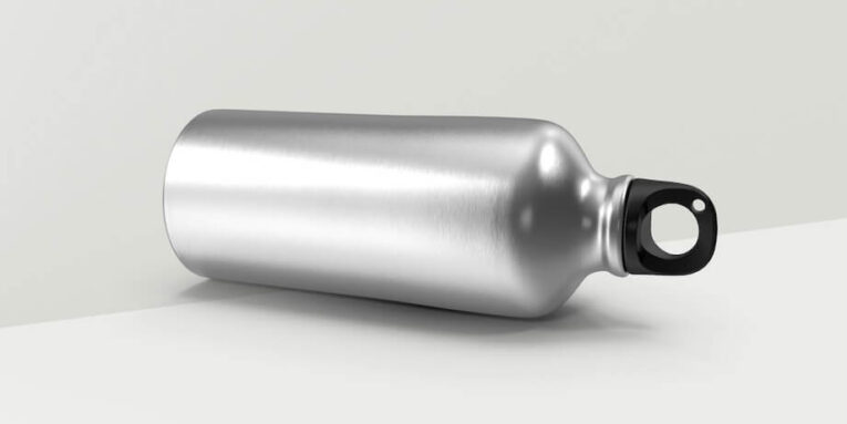 a silver bottle with a black cap on a white surface FEATURED IMAGE