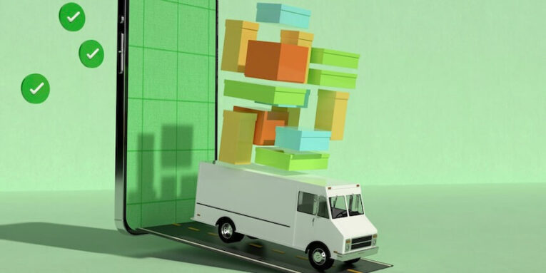a mobile phone with a delivery truck in front of it FEATURED IMAGE