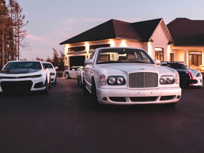 white cars on paved road
