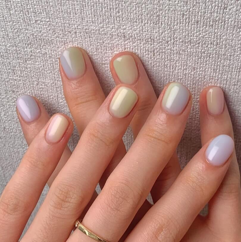 woman with a ring on her finger with simple nail design