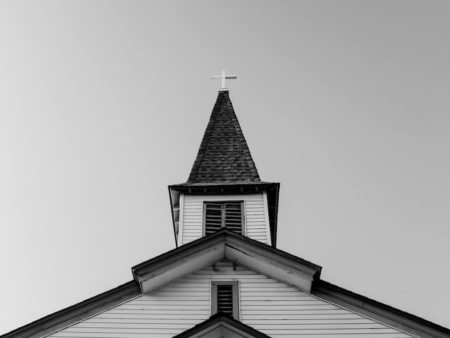 white and black concrete chapel in low angle photography