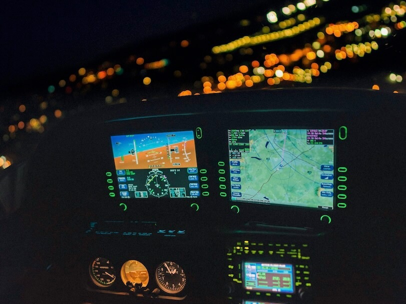 a view of the cockpit of a plane at night