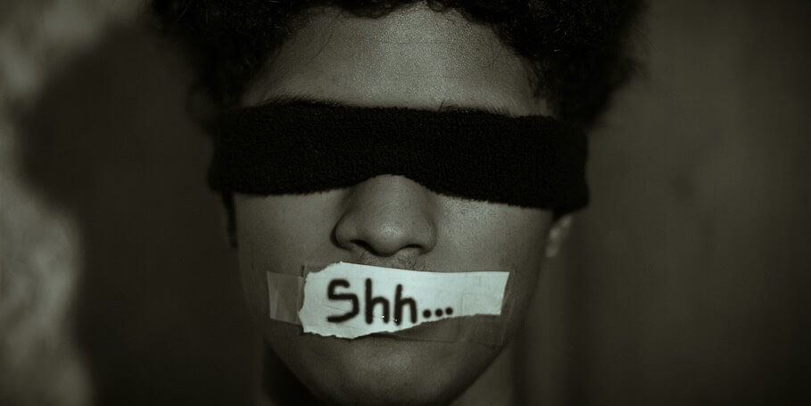 grayscale photo of man with black face mask FEATURED IMAGE