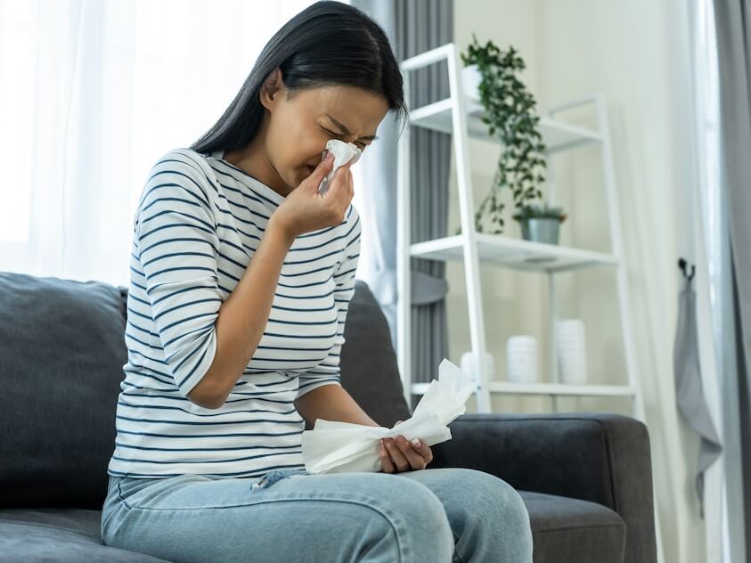 asian beautiful woman having running nose and sneezing and suffering from-allergy