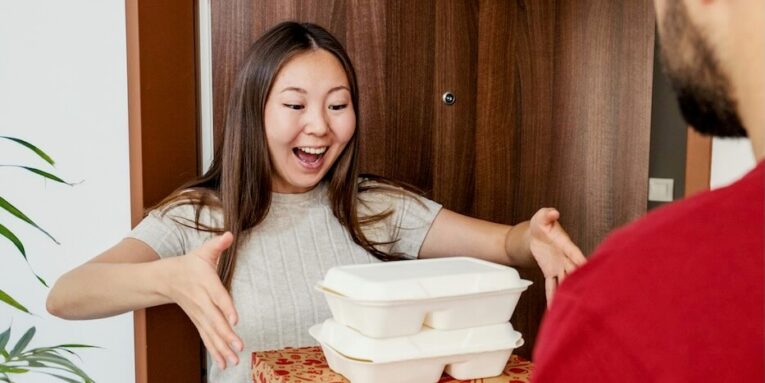 food delivery makes a woman very happy FEATURED IMAGE