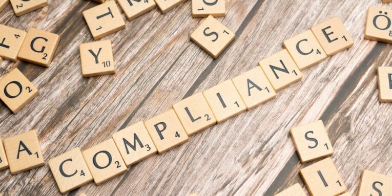 scrabble tiles spelling out the word compliance FEATURED IMAGE