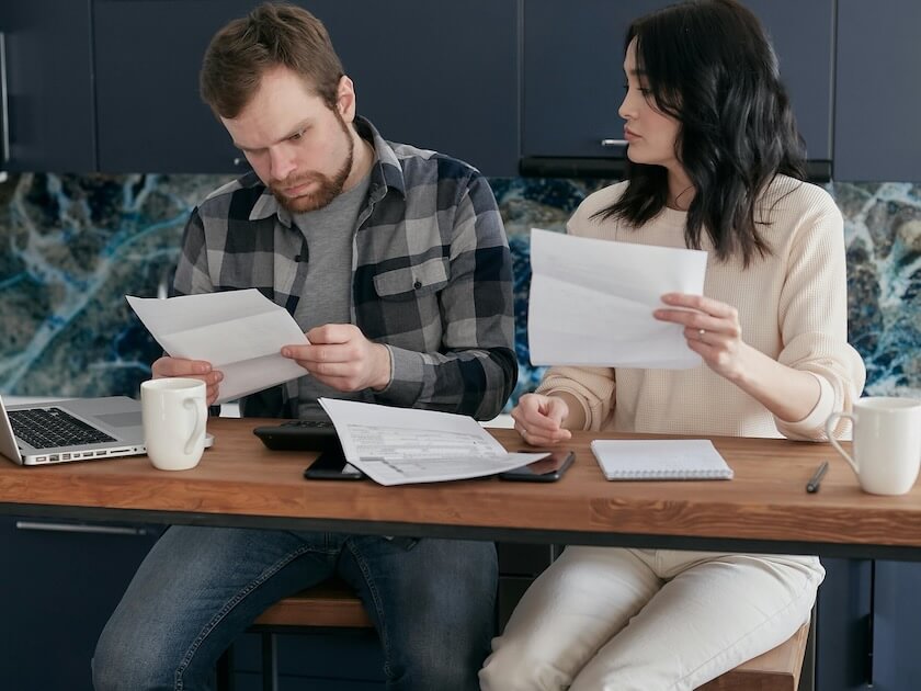 couple looking over invoices