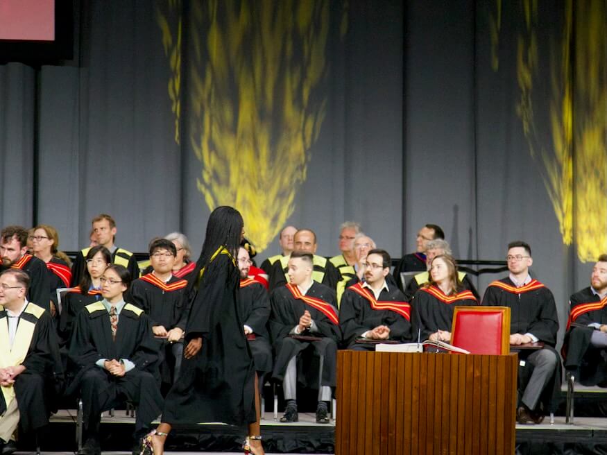 graduate walking on stage