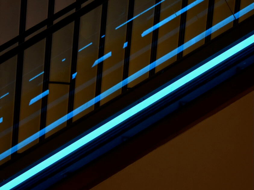 black and blue wooden cabinet with LED strip lighting