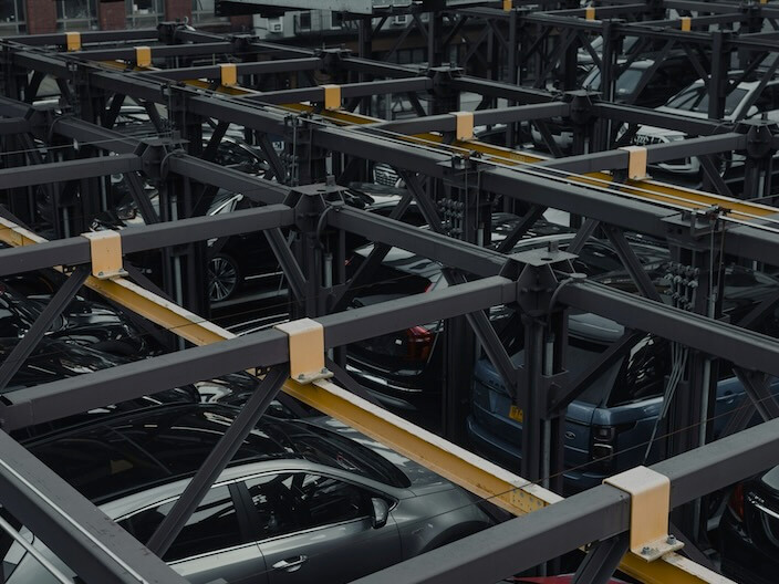 a bunch of cars parked in a parking lot