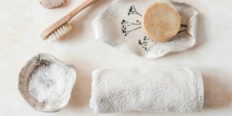 a white plate topped with a wooden spoon next to a white towel FEATURED IMAGE