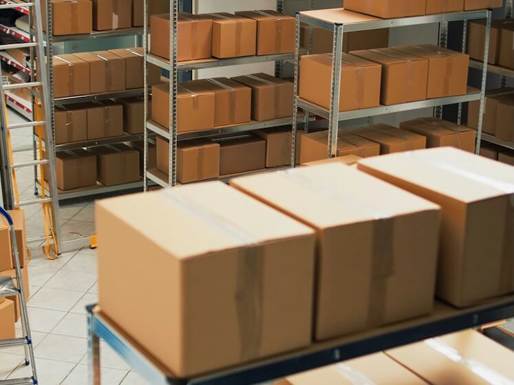 empty warehouse with office desk space and shelves storage room used for merchandise and shipping goods to clients startup development plan to ship products stock distribution