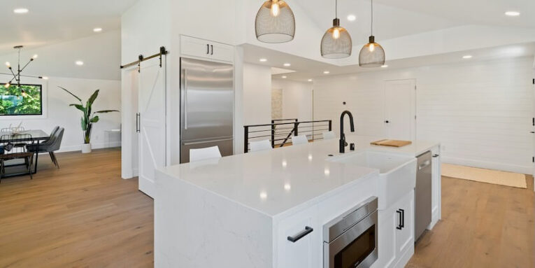 turned on pendant lamps above kitchen island FEATURED IMAGE