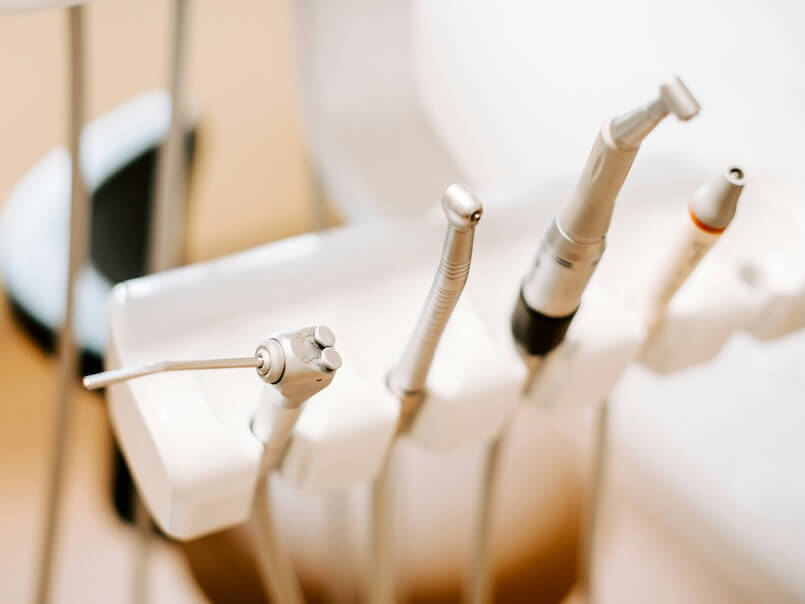a group of dental equipment pieces sitting in a holder