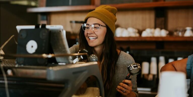 woman holding espresso making tool FEATURED IMAGE